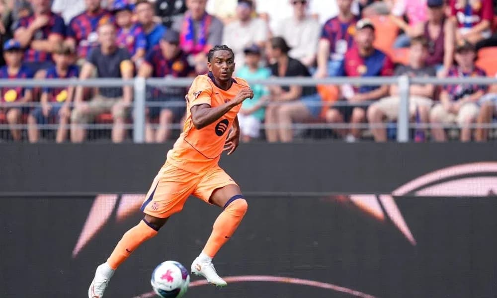 Player in orange kit sprinting on the pitch