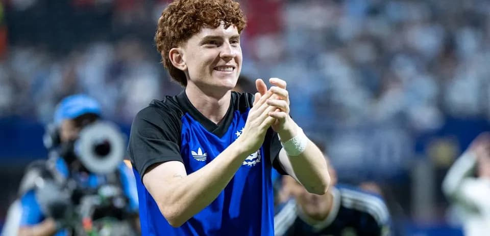 Player celebrating and clapping on the field