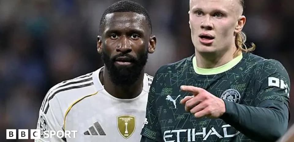 Two football players on the pitch during match