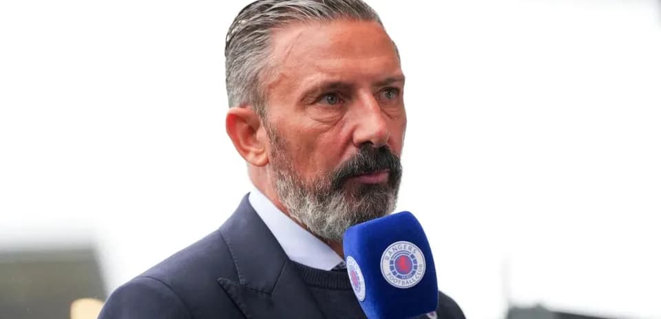 Person speaking into microphone at event