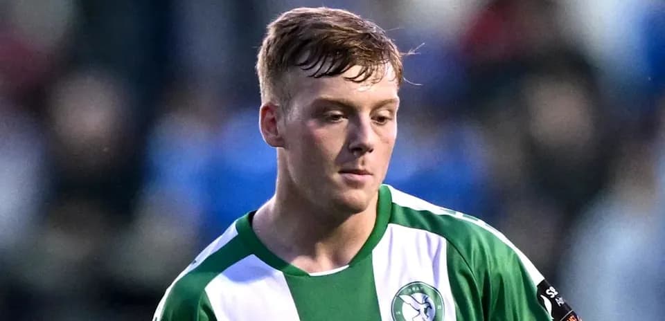 Player in green and white jersey during match