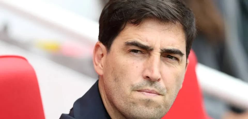 Coach sitting on the bench during a match