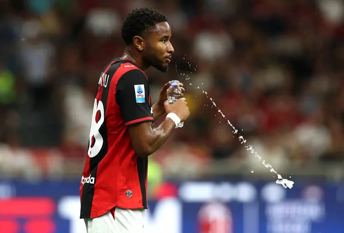 Player drinking water during match with jersey number 8