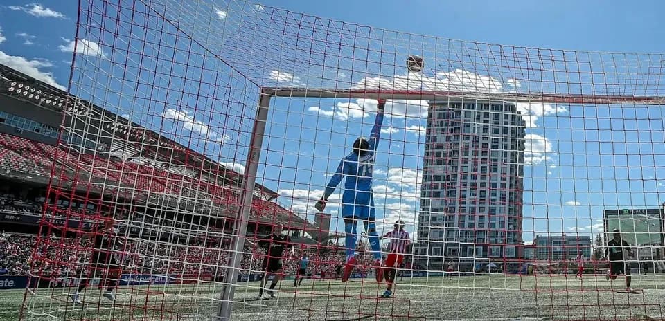 Goalkeeper jumping to save the ball