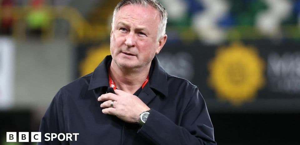 Manager walking on the pitch after match