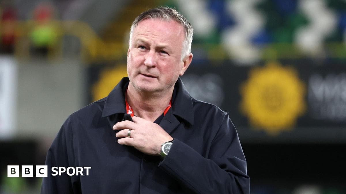 Manager walking on the pitch after match