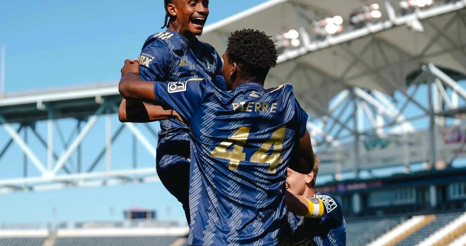 Players celebrating a goal during match