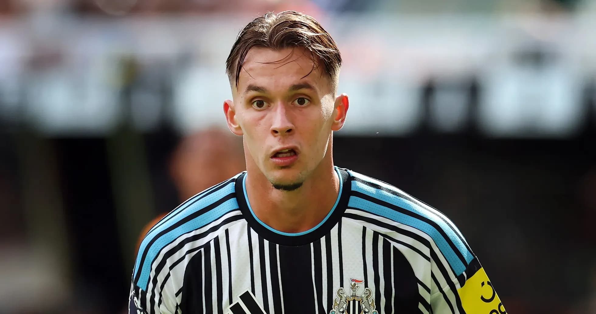 Newcastle United player preparing for play on field
