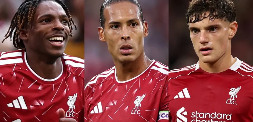 Three Liverpool players in red kits during match