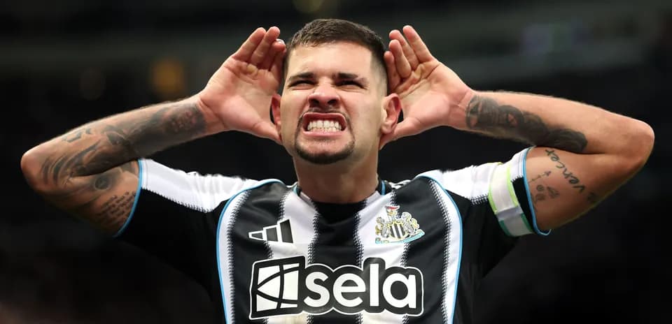 Player celebrating with hands on ears in stadium