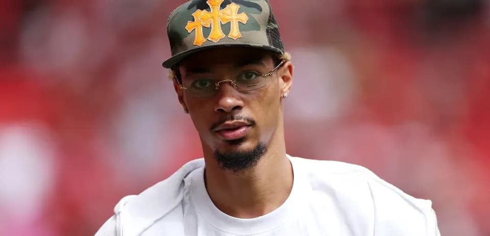 Man wearing a camo hat at sports event