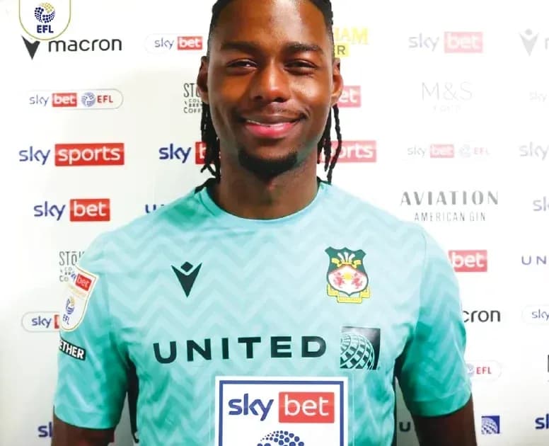 Goalkeeper in team jersey during press event