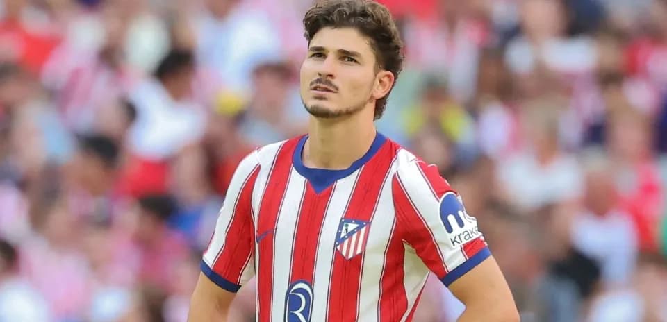 Player wearing Atlético Madrid jersey on the field