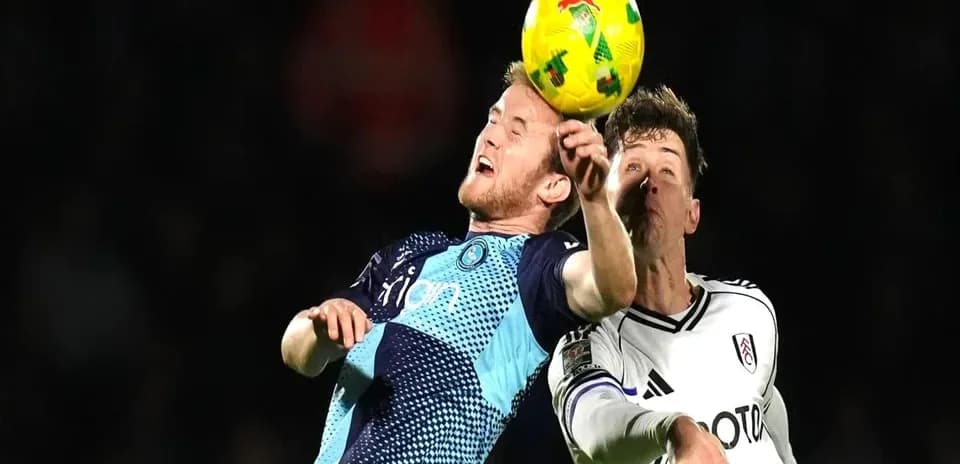 Two players contesting a header during a match