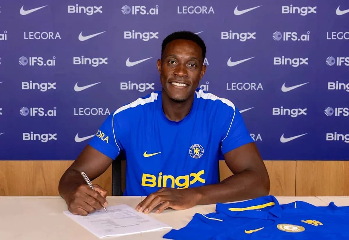 Player signing contract at club announcement event