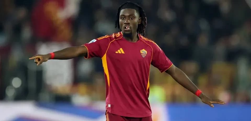 Player gesturing during match in Roma kit