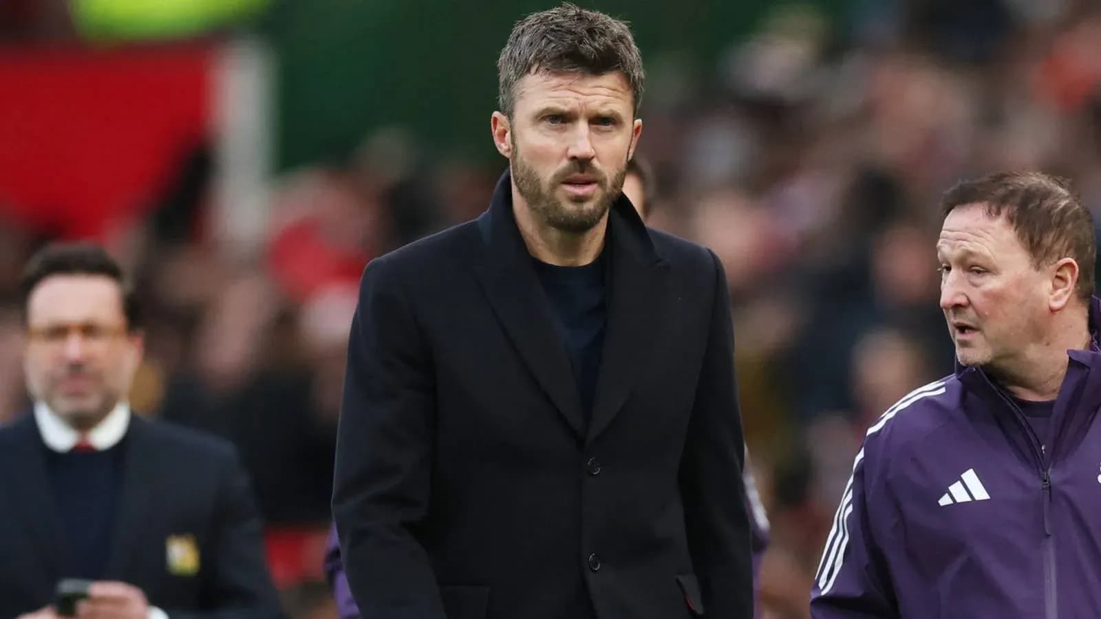 Coaches walking on the sideline during match