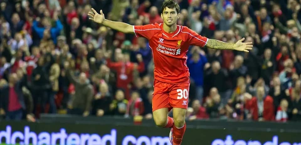 Player celebrating a goal with fans in background