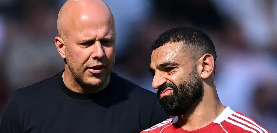 Two men talking during a football match