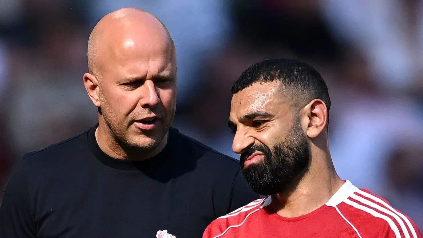 Two men talking during a football match