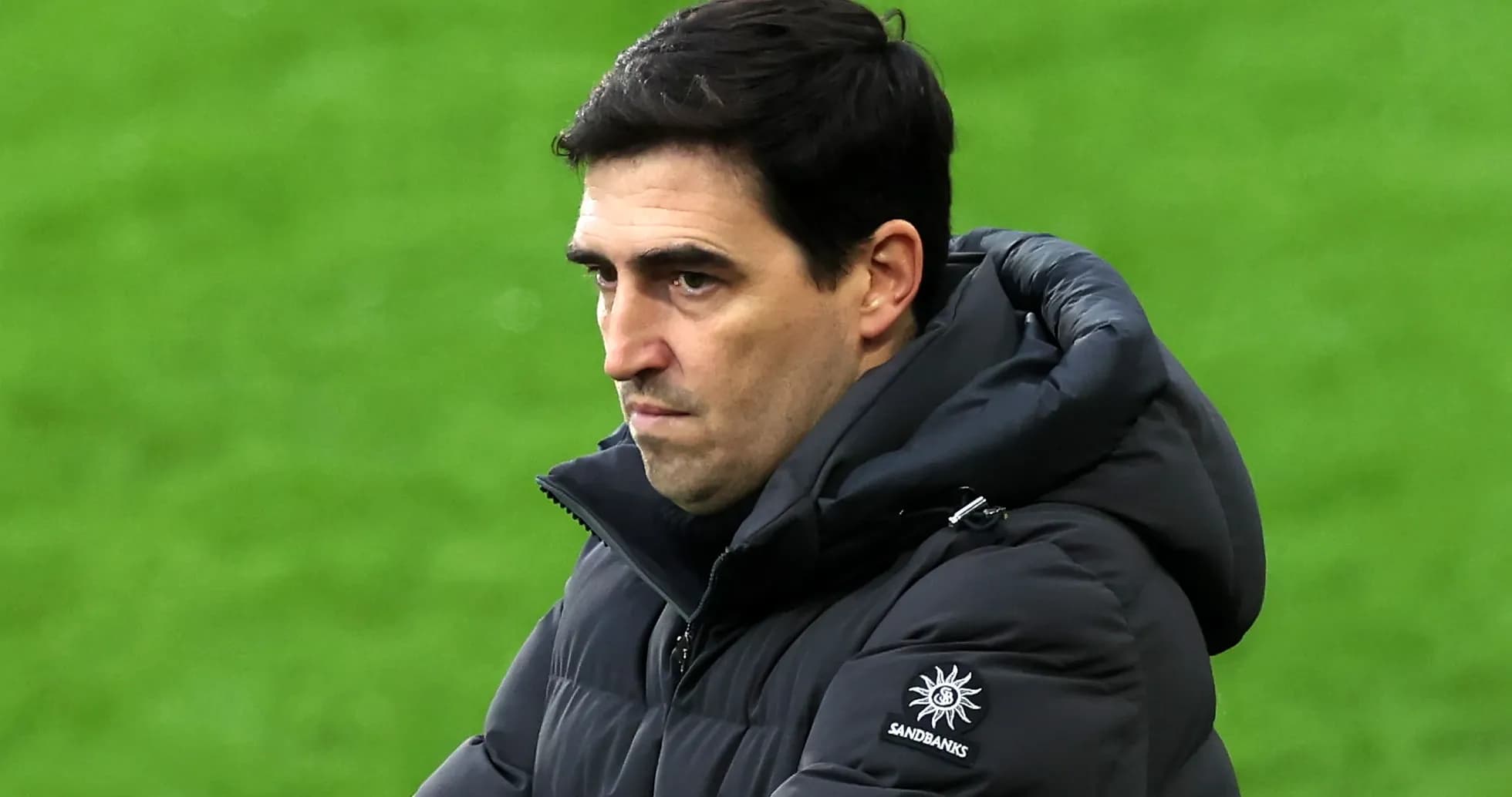 Coach observing the match from the sidelines