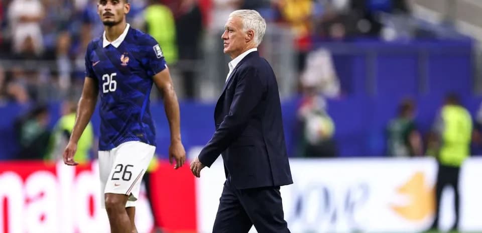 France coach walking past player on the field