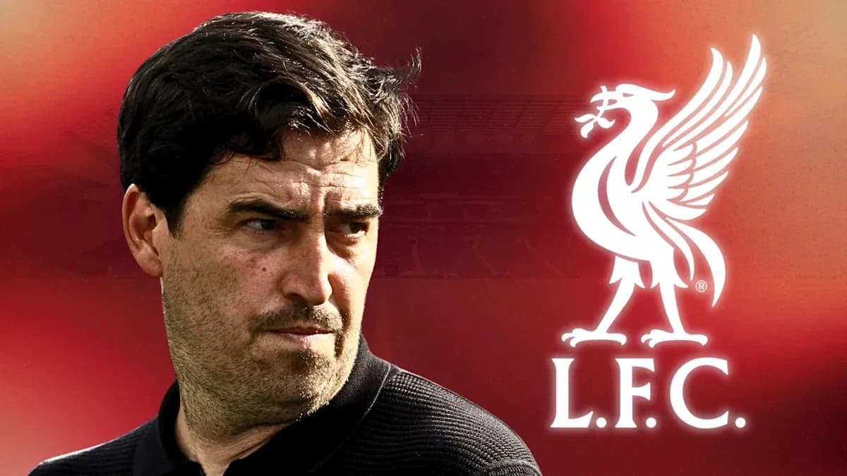 Coach with Liverpool logo in background