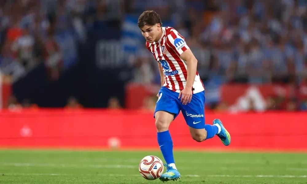 Atletico Madrid player dribbling during match