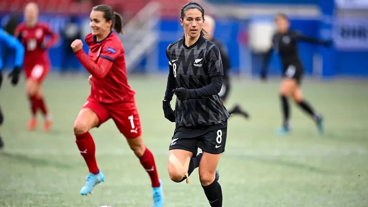 New Zealand player running during match against opponent