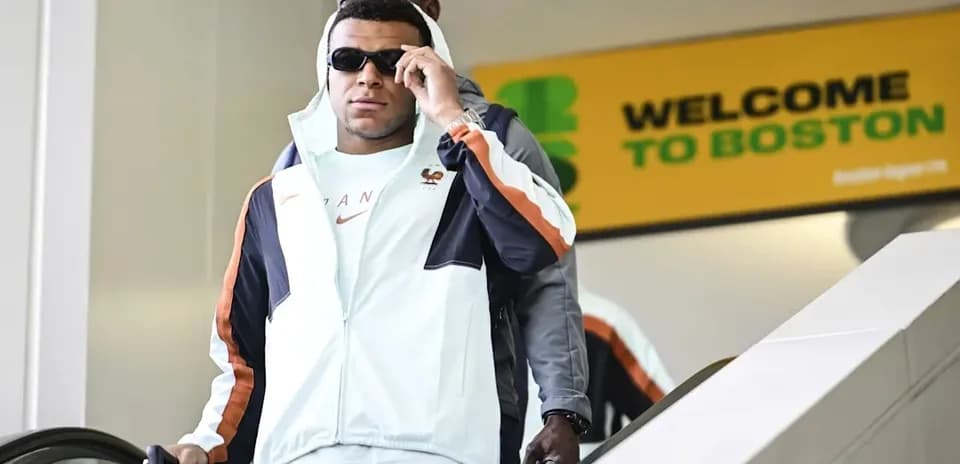 Player arriving at Boston airport wearing sunglasses
