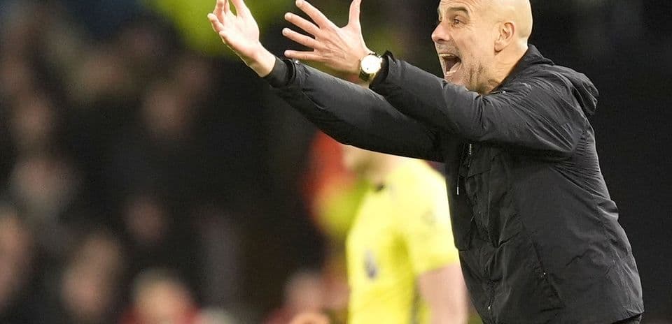 Manager gesturing on the sidelines during match