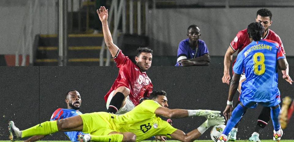 Players competing for the ball near the goal