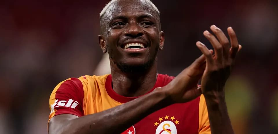 Player celebrating and applauding fans after match