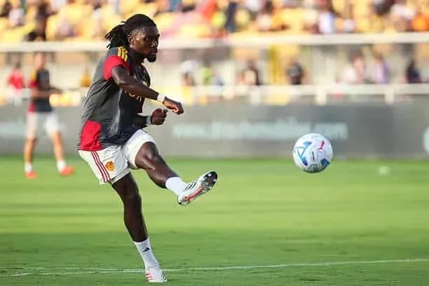Player kicking ball during warm-up session