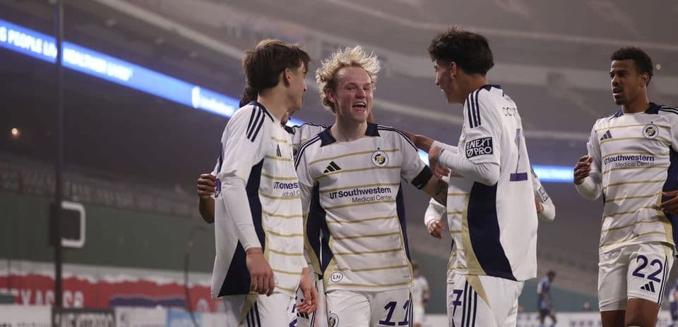 Players celebrating a goal in MLS Next Pro match