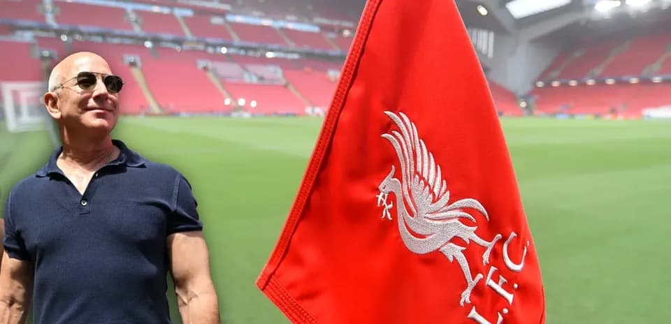 Man near Liverpool FC corner flag at stadium