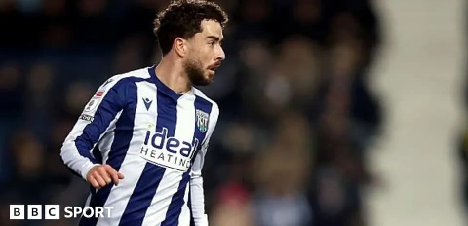 Player in striped West Bromwich Albion kit during match