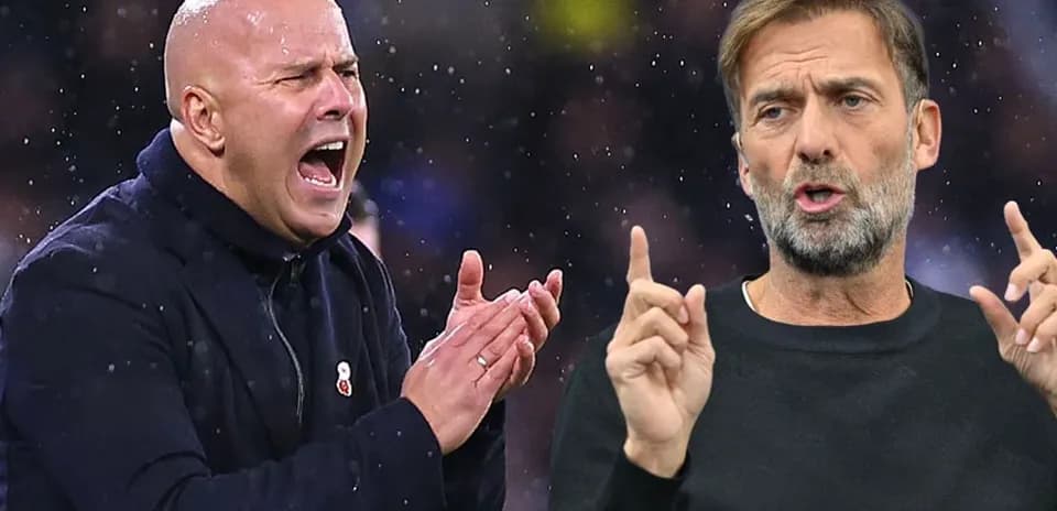 Two football managers animatedly discussing during match