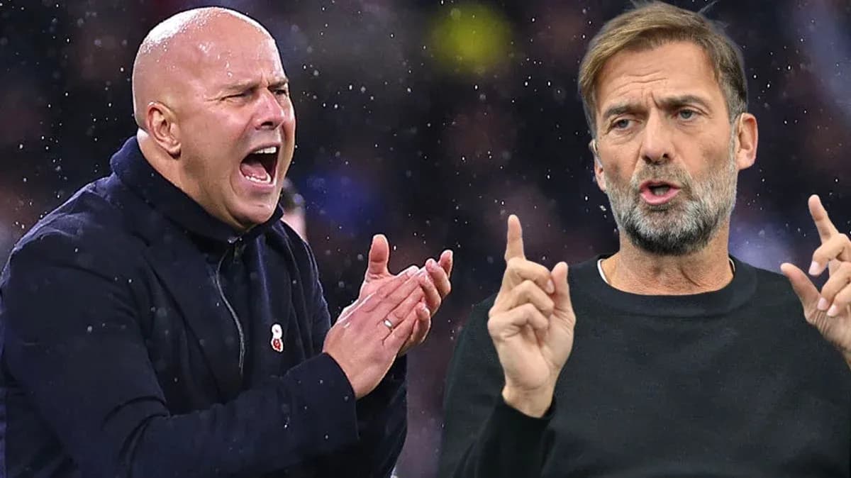Two football managers animatedly discussing during match