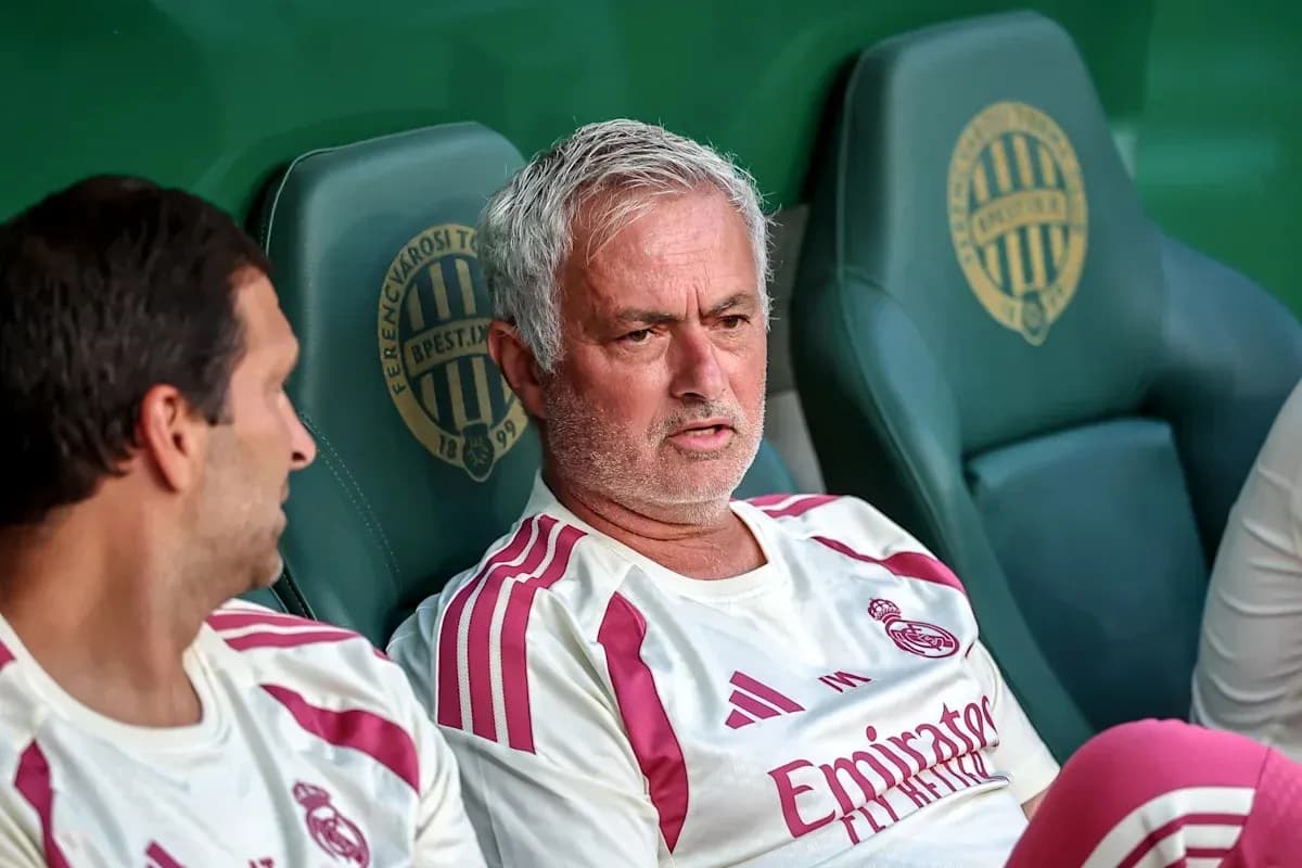 Coaches seated on the bench during match