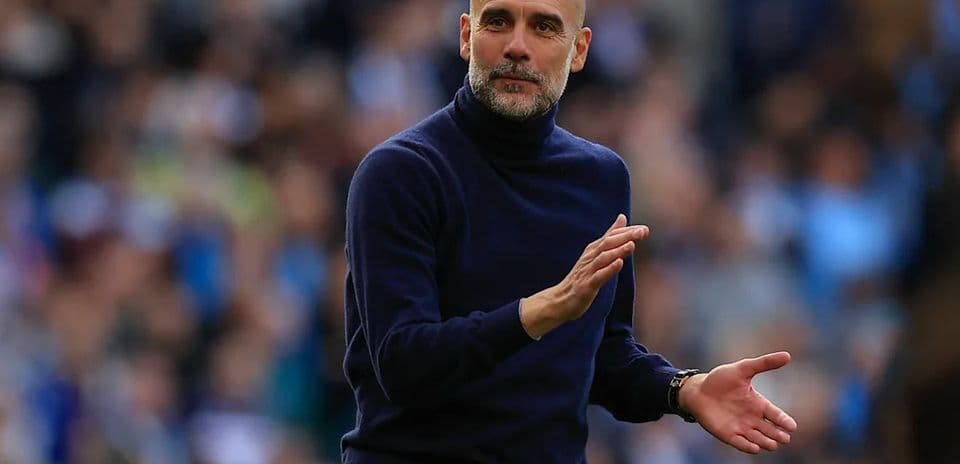 Manager gesturing during match on the sidelines