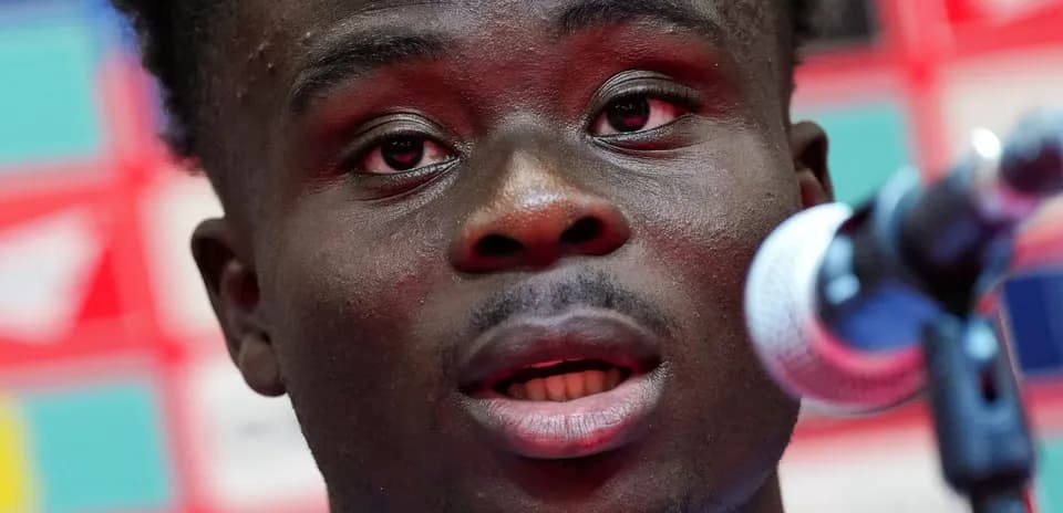 Player speaking at a press conference microphone