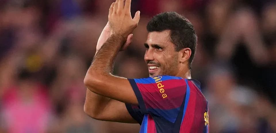 Player celebrating with fans after match at Camp Nou