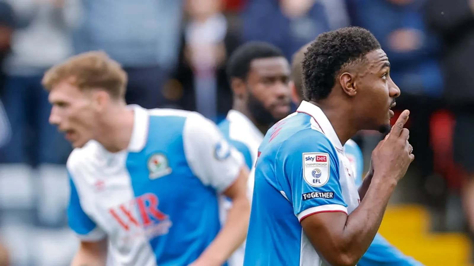 Player celebrating and shushing after scoring goal
