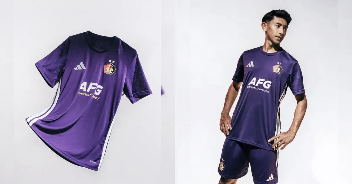 Purple football kit displayed and modeled by player