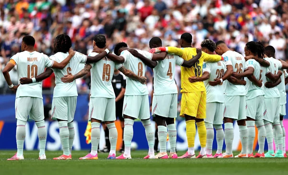 Football team standing in solidarity before match