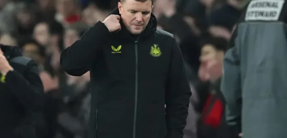 Newcastle manager walking off the pitch after match