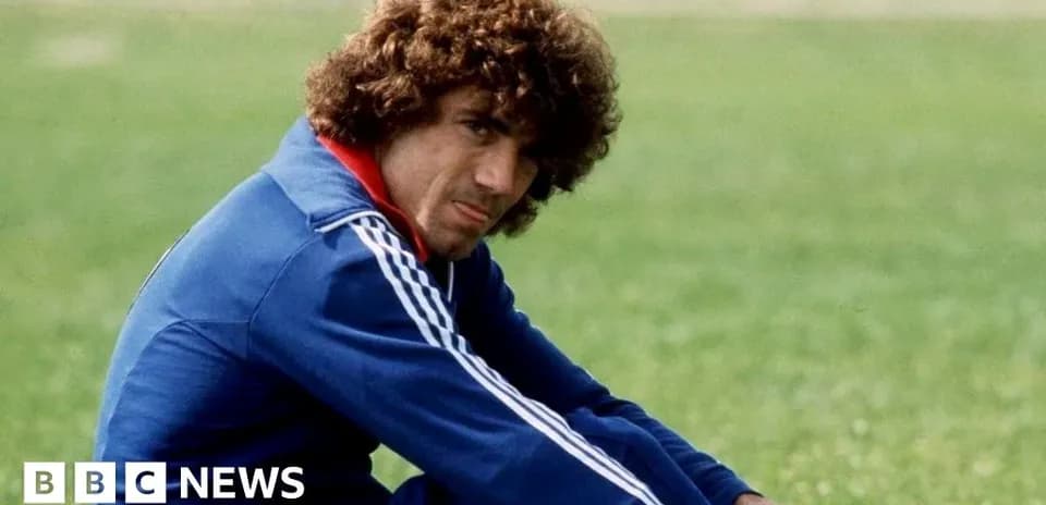 Athlete sitting on grass during training session