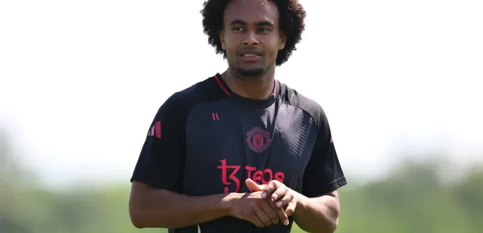 Player in Manchester United training kit outdoors