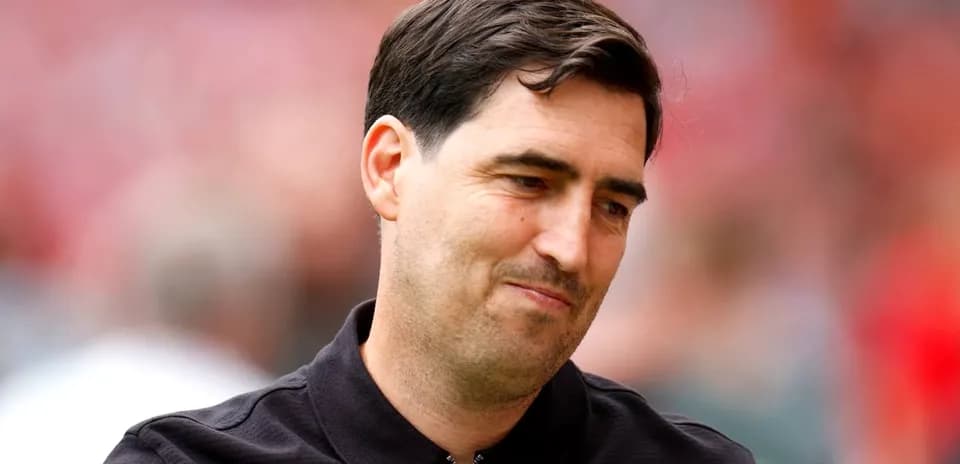 Football manager on the pitch before a match